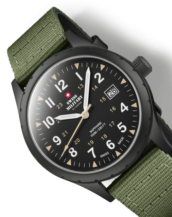 wiss Military SM34108.07 close-up showing matte black dial, luminous hands, beige military hours, sandblast finish case, and green canvas strap.